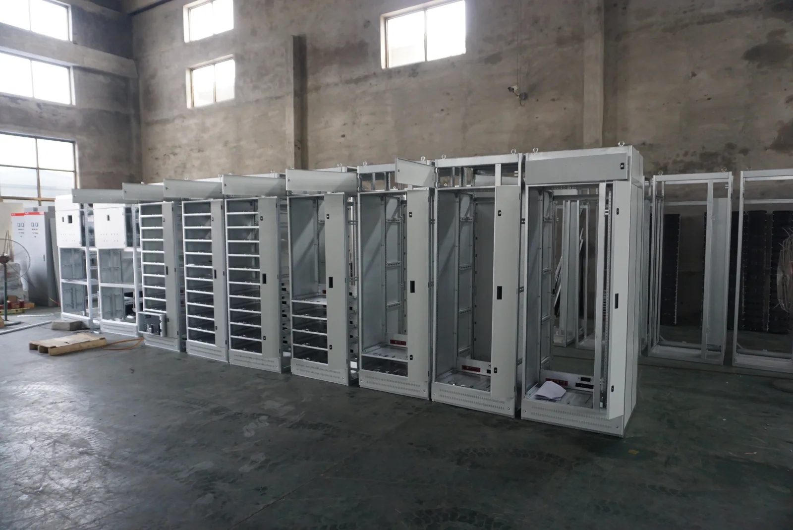 Electrical cabinet frames showing formed openings and structural members