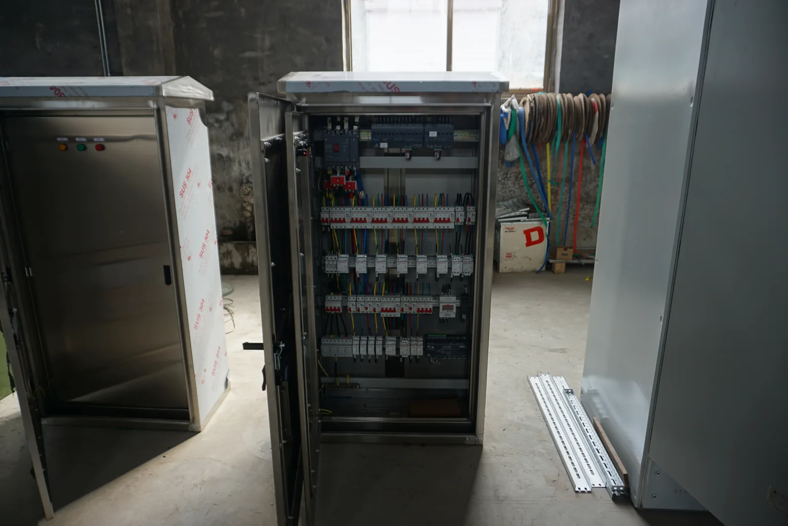 Control cabinet interior with mounted electrical components and wiring