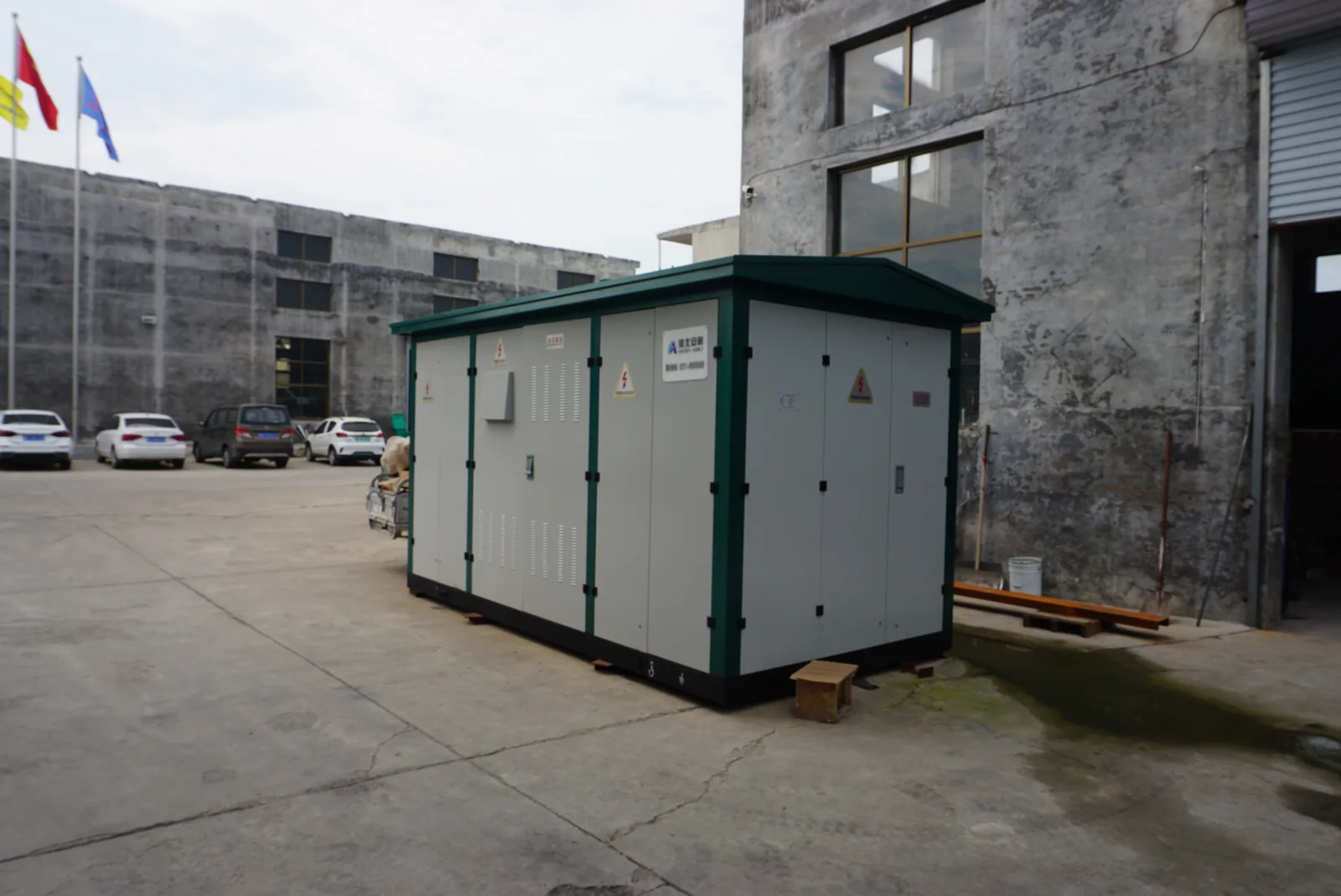 Outdoor metal equipment enclosure with several compartments and separate doors